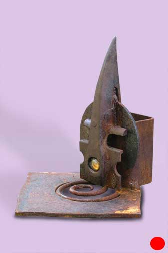 Metal sculpture - Square metal base with metal spiral in center hole; metal spike protrudes